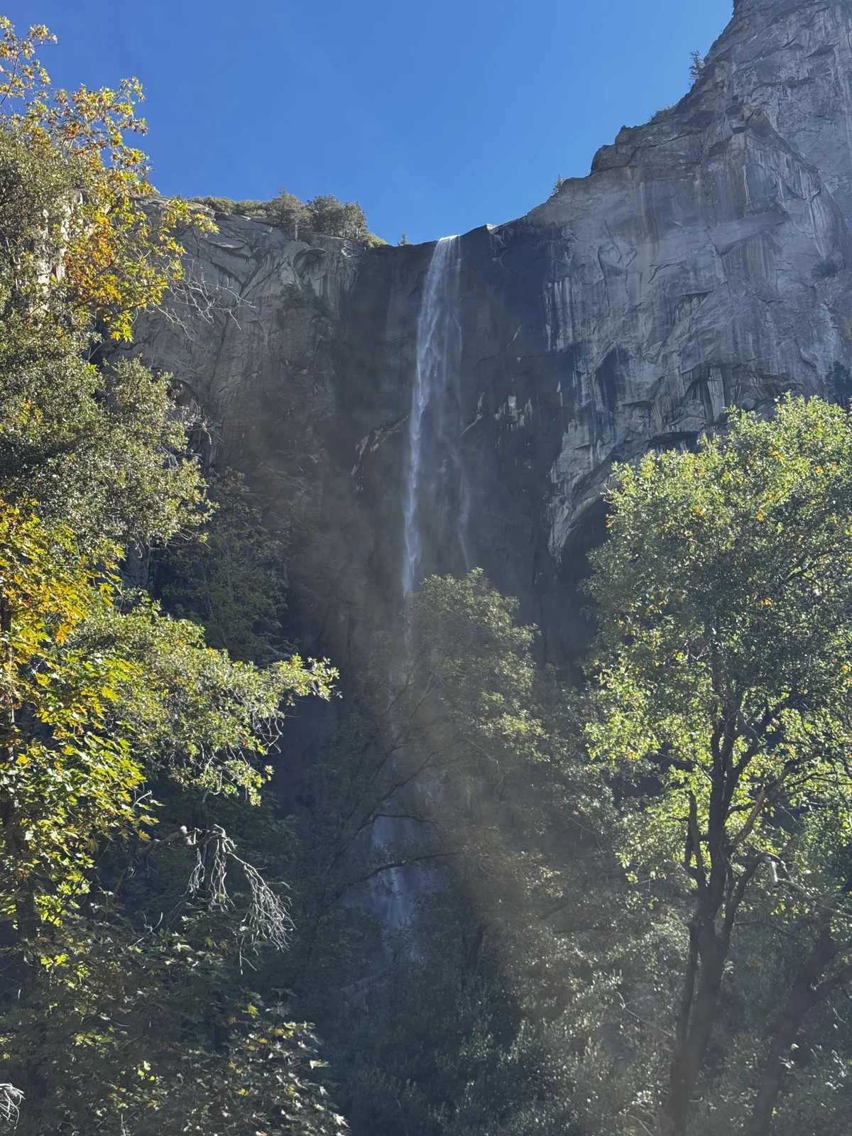Bridalveil Fall in October, with a gentler autumn flow and the first fall color along the trail