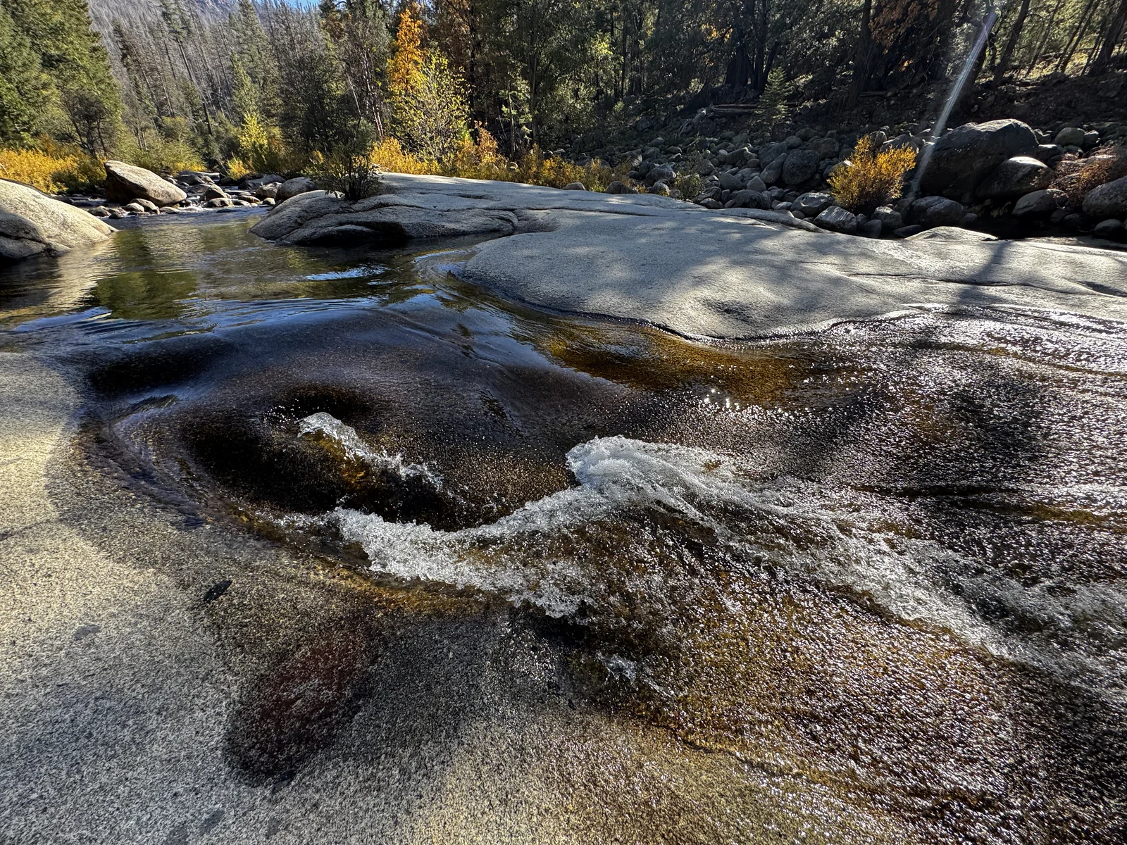Smooth granite and low autumn water along the South Fork of the Merced in Wawona